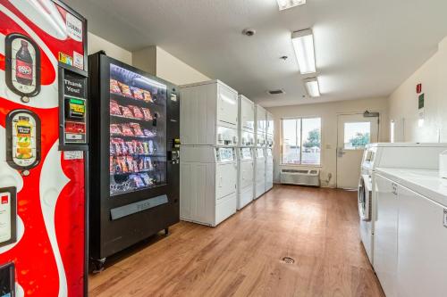 a room with a soda vending machine in a store at Studio 51 Extended Stay Hotel in Phoenix