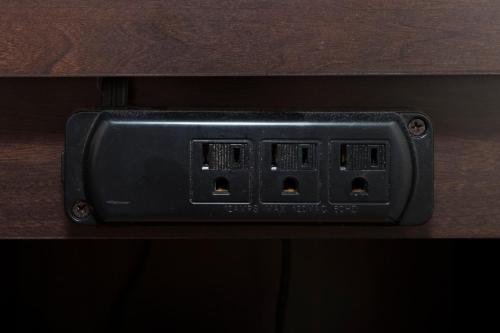 a black light switch on a wooden table at Red Roof Inn Wildwood – Cape May/Rio Grande in Rio Grande