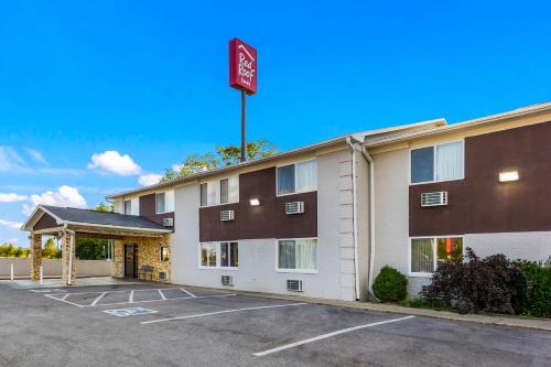 a front view of a hotel with a parking lot at Red Roof Inn Dry Ridge in Dry Ridge