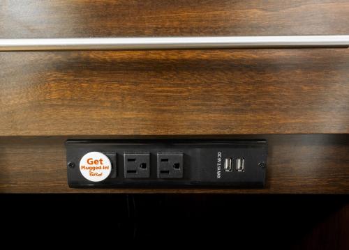 a close up of a clock on a wooden table at Red Roof Inn PLUS+ Baltimore-Washington DC/BWI Airport in Linthicum Heights