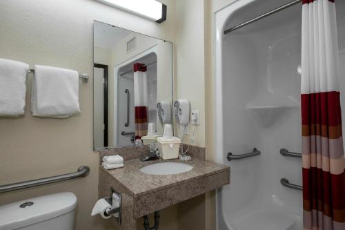 A bathroom at Red Roof Inn Charlotte - University