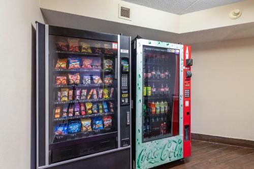 a soda vending machine in a room with drinks at Red Roof Inn PLUS+ El Paso East in El Paso
