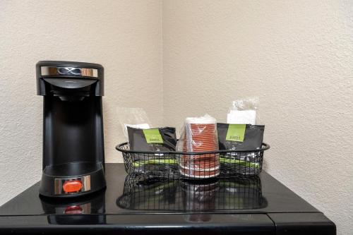 a coffee maker sitting on top of a table at Red Roof Inn & Suites Biloxi - Ocean Springs in Biloxi