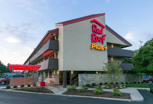 a restaurant with a red roof plus sign on the side of a building at Red Roof Inn PLUS+ Columbus-Ohio State University OSU in Columbus