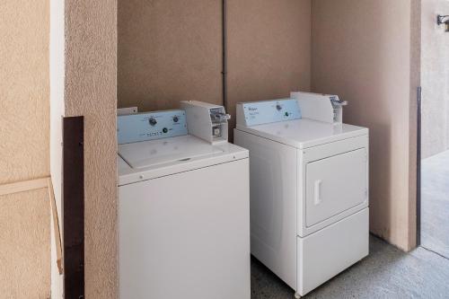 two washing machines and a washer and dryer in a room at Red Roof Inn & Suites Rome in Rome