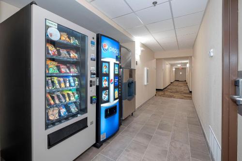 a hallway with two vending machines in a hospital at Red Roof Inn PLUS+ Jacksonville – Southpoint in Jacksonville