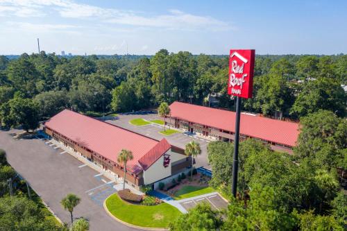 an overhead view of a fast food restaurant with a red roof at Red Roof Inn Tallahassee - University in Tallahassee