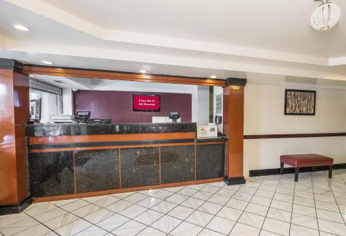 a lobby with a bar in a hotel at Red Roof Inn Hartford - Vernon in Vernon