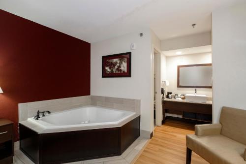 a bathroom with a large bath tub in a room at Red Roof Inn Helen in Helen