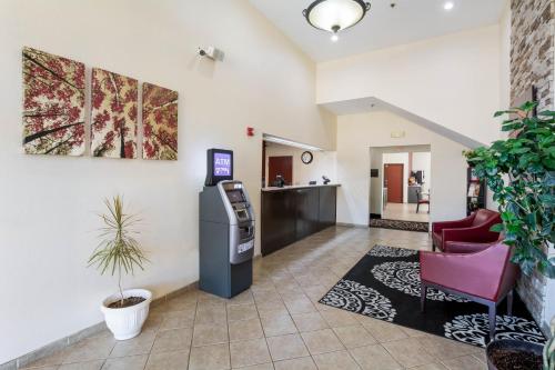 a waiting room with a atm in a building at Red Roof Inn Carrollton in Carrollton