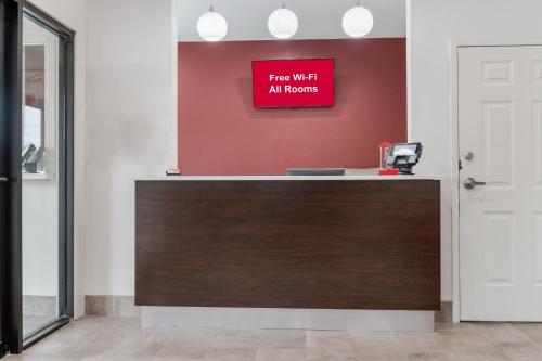 a sign that reads fire wax all rooms on a wall at Red Roof Inn Houston – Spring North in Spring