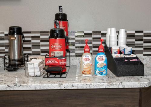 a counter with two bottles of ketchup and condiments at Red Roof Inn Gulfport - Biloxi Airport in Gulfport