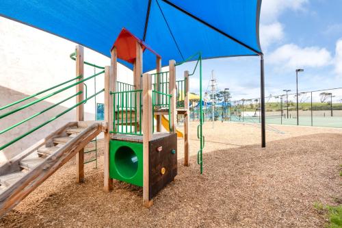 a playground with a slide at a park at RACV Torquay Resort in Torquay