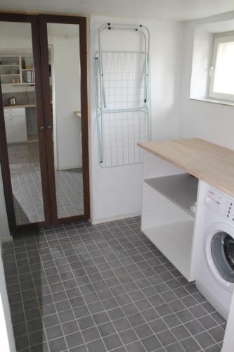 a laundry room with a washer and dryer at Helsinki Hideaway in Helsinki