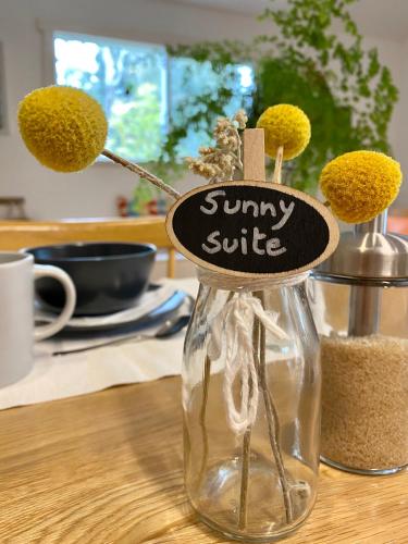 a glass jar with a tiny smile sign on it at Sunny Side Up B&B Rye in Rye