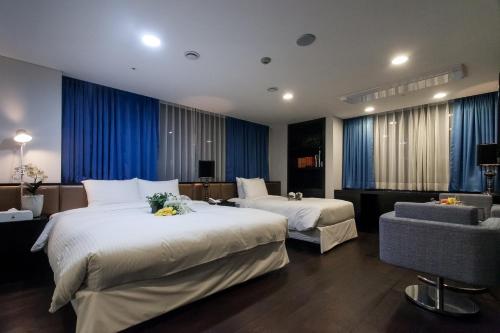 Postel nebo postele na pokoji v ubytování Hotel Pharos