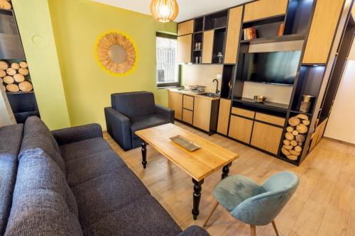 a living room with a couch and a table at Jahorinski IZLOG in Jahorina
