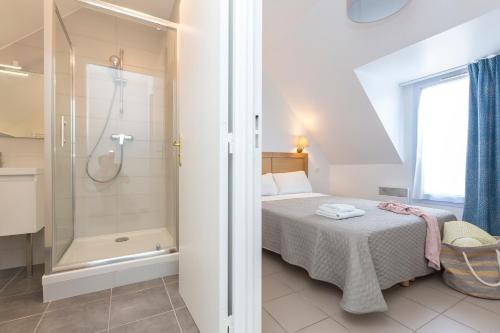 Voodi või voodid majutusasutuse Résidence Odalys Les Bains toas