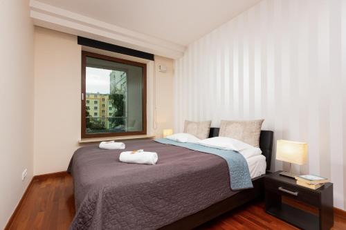 Llit o llits en una habitació de Warsaw City Center Exclusive by Renters Prestige