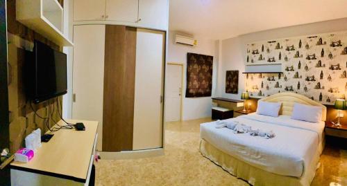 Postel nebo postele na pokoji v ubytování Cupid Hotel