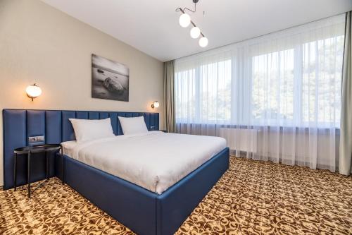 Postel nebo postele na pokoji v ubytování Žilvinas Hotel