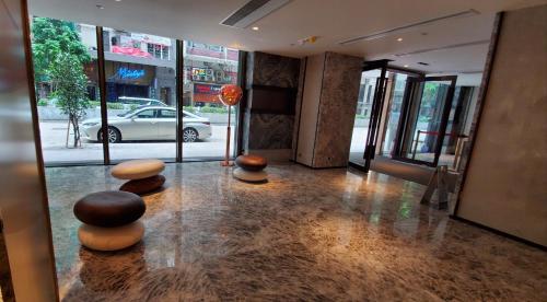 a lobby with spheres on the floor of a building at Wharney Hotel in Hong Kong