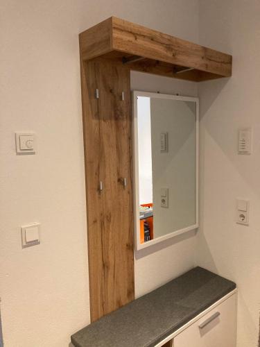 a bathroom with a mirror on the wall at Appartement Katrin in Bramberg am Wildkogel