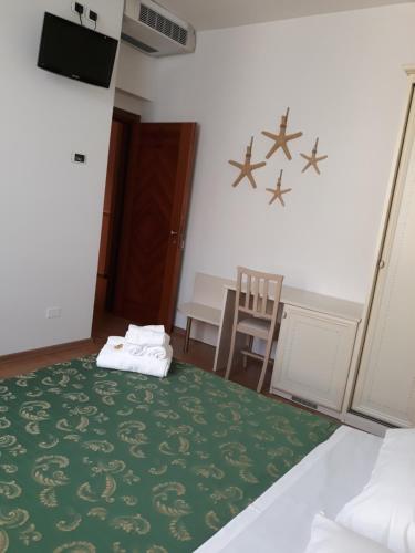Ένα ή περισσότερα κρεβάτια σε δωμάτιο στο Hotel La Palazzina
