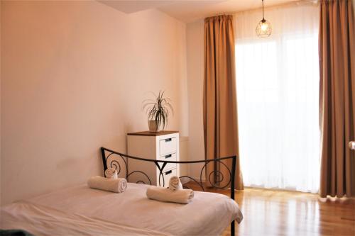 
Un pat sau paturi într-o cameră la Cluj CITY Vibe
