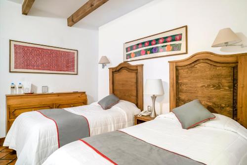 Lova arba lovos apgyvendinimo įstaigoje Hotel Posada El Zaguán