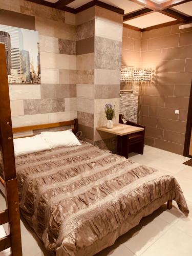 a bedroom with a large bed and a sink at WINE & ROSE BOUTIQUE HOTEL in Kharkiv
