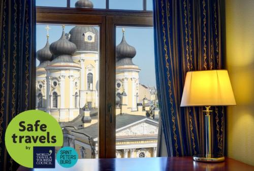 a window with a view of a church at Dostoevsky Hotel in Saint Petersburg