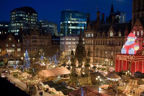 a christmas market in a city at night at Manchester Portland By Sunday in Manchester