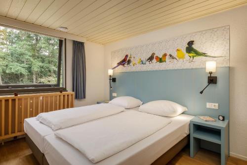 Katil atau katil-katil dalam bilik di Center Parcs De Eemhof