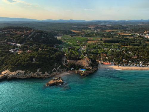 an aerial view of a beach and the ocean at Mediterrani Natura Spa Resort in Tarragona