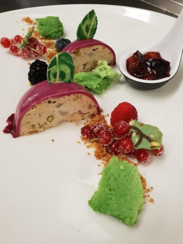 a white plate with some food on it at Alpengasthof Grüner in Sölden