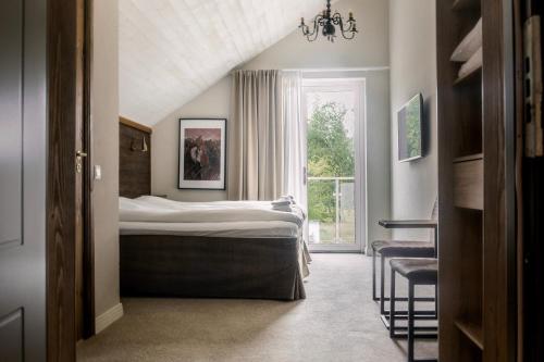 Säng eller sängar i ett rum på Lydinge Resort