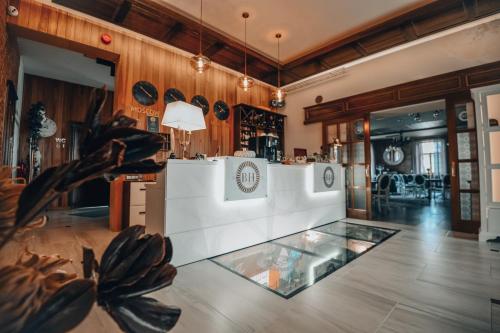 a large kitchen with a glass floor in a room at Bahnhofs hotel in Alūksne