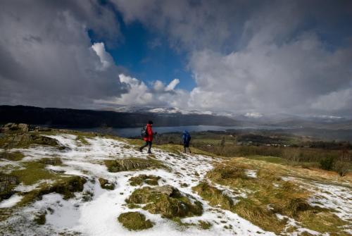 two people standing on top of a snow covered mountain at Ivythwaite Lodge Guest House in Windermere