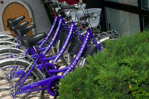 a group of blue bikes parked next to each other at Hotel Maré - Valentini Family Village in Bellaria-Igea Marina