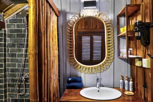 a bathroom sink with a mirror above it at Sok San Beach Resort in Koh Rong Island