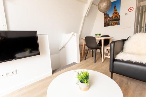 A television and/or entertainment center at Alkmaar City Apartments