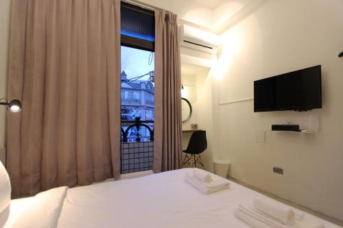 Katil atau katil-katil dalam bilik di 張三旅宿Zhang San Guest House