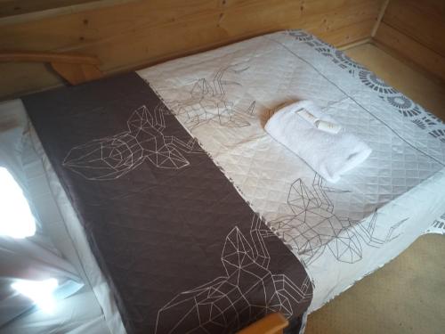 Zajazd pod Chmurkąにあるベッド