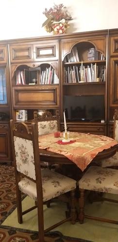 a dining room table with two chairs and a table with at Vasari Home in Arezzo
