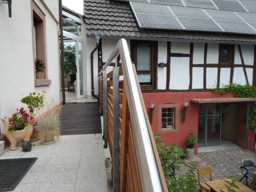 a balcony of a house with a solar roof at Ferienwohnung Stockemer Haecke in Stockheim