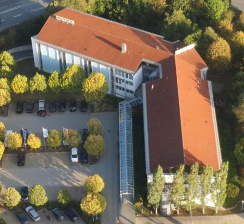 an overhead view of a building with a parking lot at Hotel Wörth in Wörth an der Isar