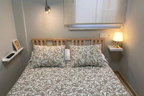 Postel nebo postele na pokoji v ubytování New Studio Sito 8 Parking Gratis