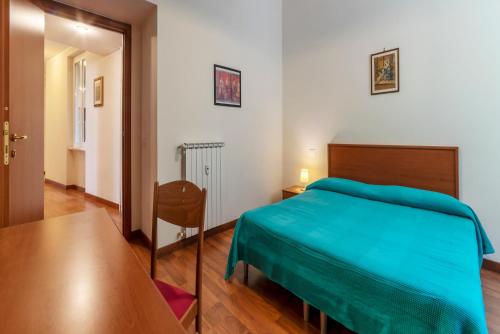 Ένα ή περισσότερα κρεβάτια σε δωμάτιο στο Piazza Re di Roma Apartment