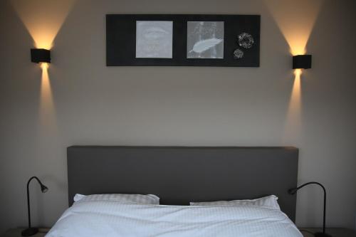 Postel nebo postele na pokoji v ubytování Durbuy House
